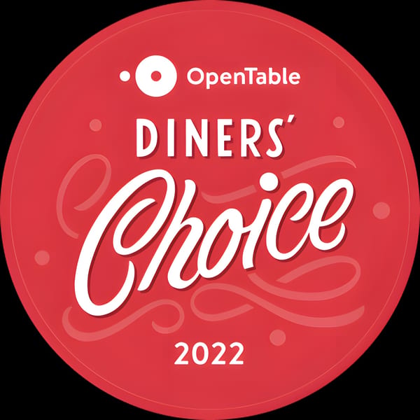 Red circular OpenTable Diners' Choice 2022 award logo with white text.