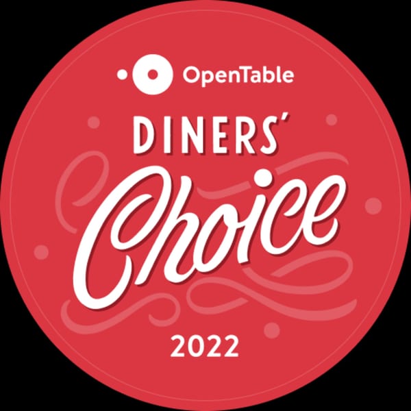 Red circular OpenTable Diners' Choice 2022 award badge with white text.