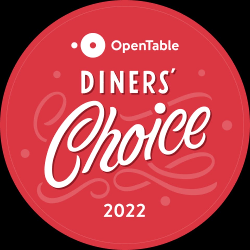 Red circular OpenTable Diners' Choice 2022 award badge with white text.